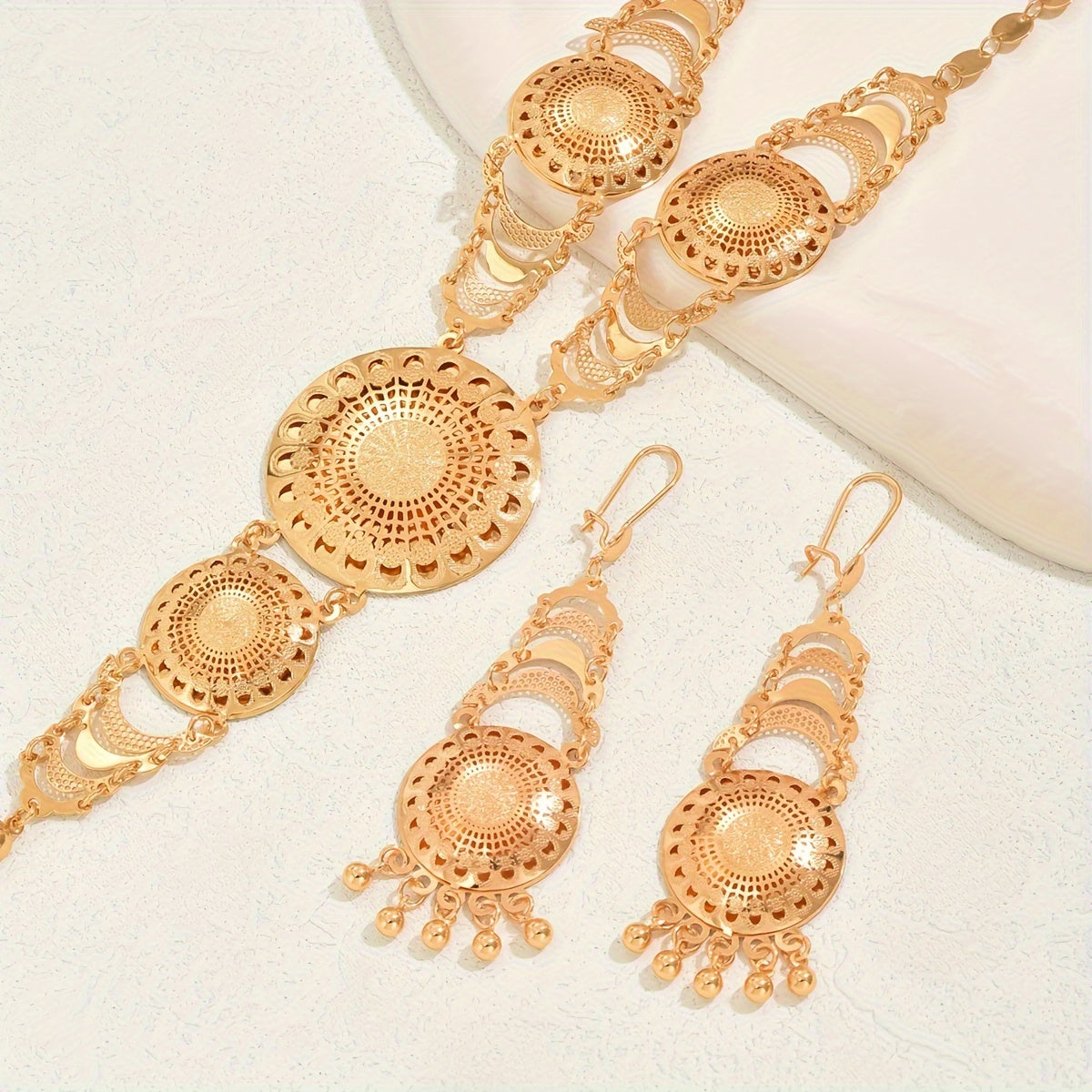 Retro Ramadan inspired copper gold plated necklace and earrings set featuring a creative sun flower design and tassel detail. Perfect for adding an elegant touch to women's party and wedding attire.