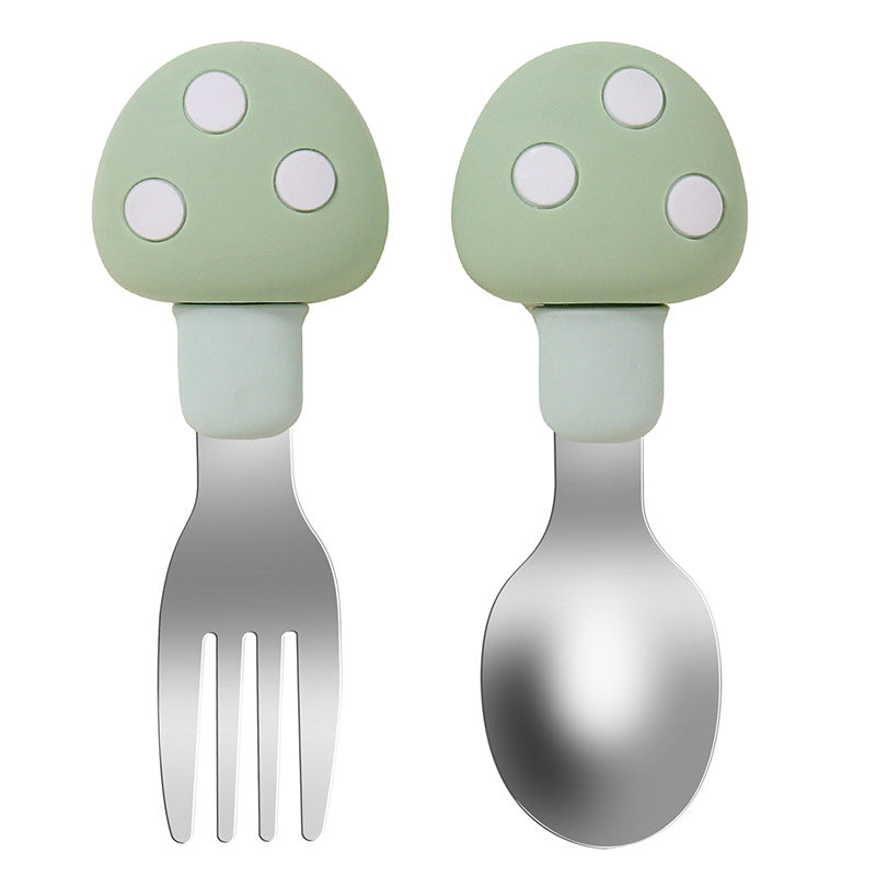 Set of feeding utensils for babies made of silicone and featuring a mushroom design. Includes a spoon and fork.