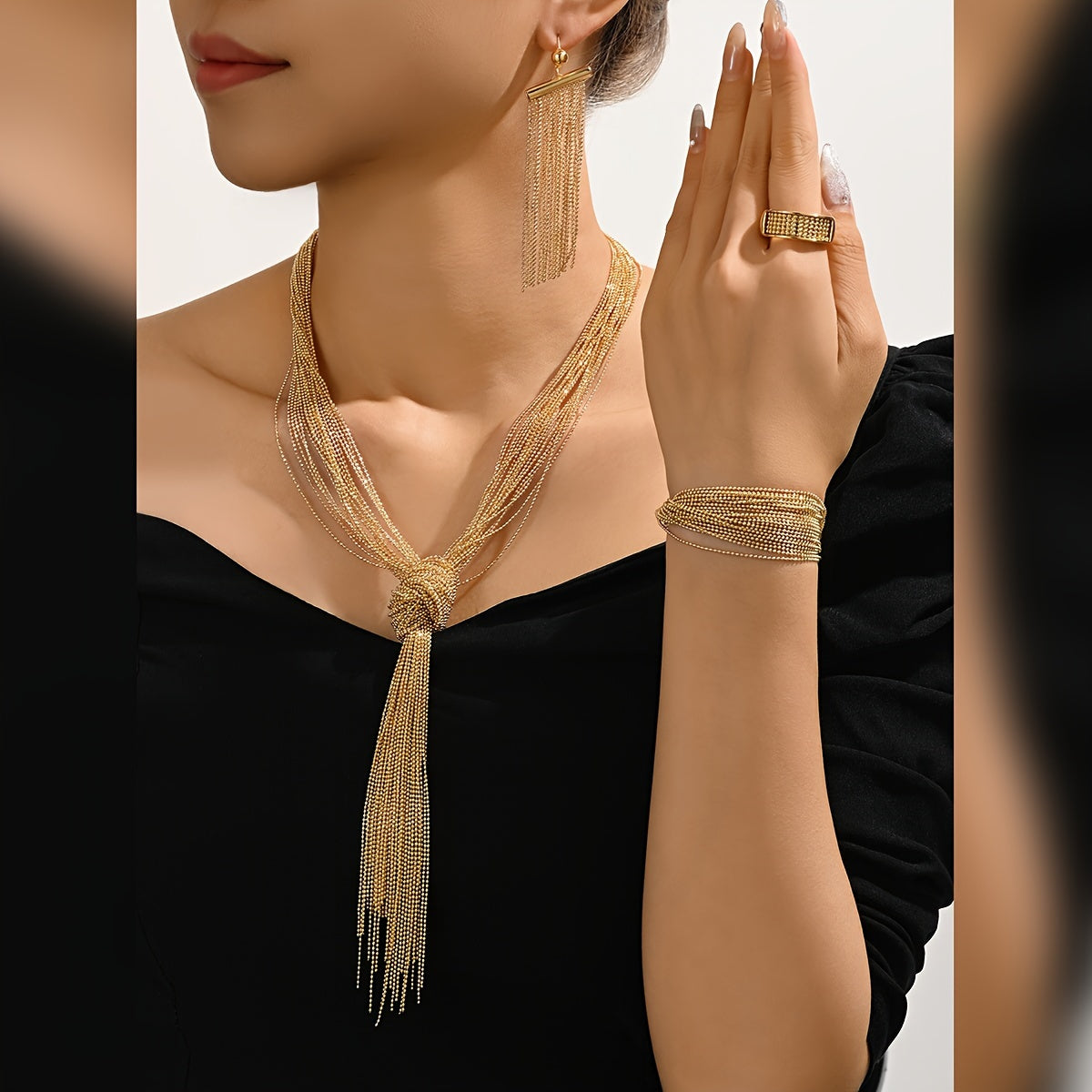 Experience the Exquisite MEIZ Luxury Hip-Hop Style Jewelry Set, featuring 18K Golden Plated Copper with Hollow Tassel Earrings, Tassel Necklace, Ring, and Bracelet. Perfect for Daily Wear or as Wedding Accessories, this Set is Ideal for Gift-Giving and