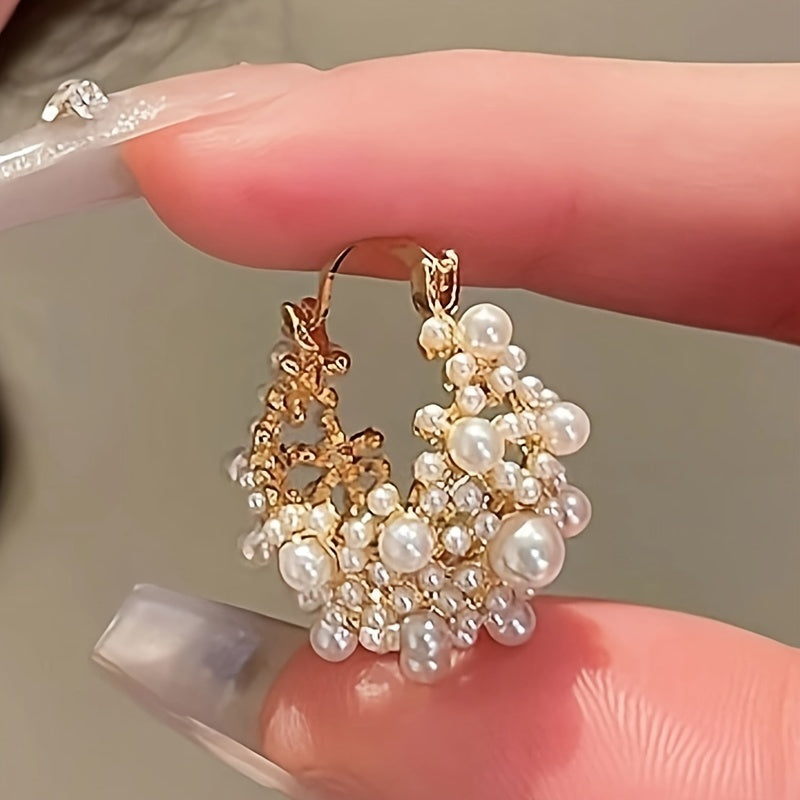 Elegant French-style U-shaped hoop earrings featuring faux pearls and beads, with a delicate hollow-out design ideal for women. A must-have accessory for vacations and parties.