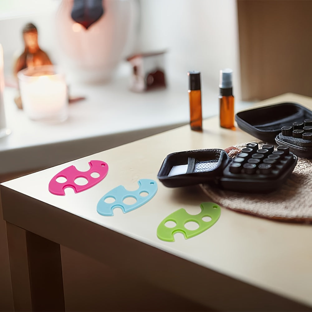 Durable tool for easy removal of essential oil bottle caps - colorful plastic opener with roller ball.