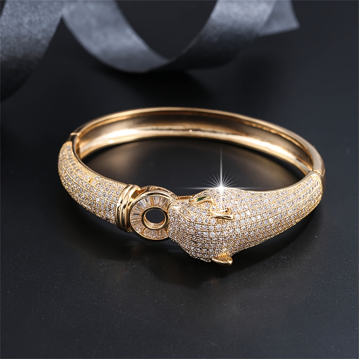 An elegant bracelet featuring a striking leopard head design, adorned with synthetic zirconia stones, making it a distinctive and opulent accessory for women to elevate their look at weddings and formal events.