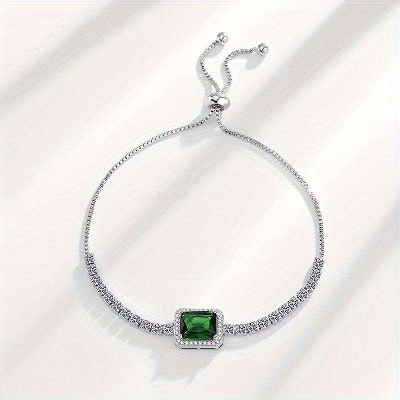 An elegant and luxurious women's bracelet featuring dazzling green Zirconia stones, crafted in adjustable 925 silver weighing just 4.3g. Perfect for daily wear, special occasions, and gifting, especially for Middle Eastern events.