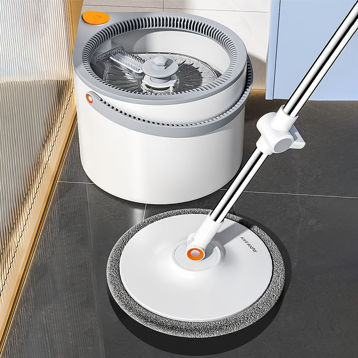 Spin Mop and Bucket System with Three Mop Heads and Washable Microfiber Pads.