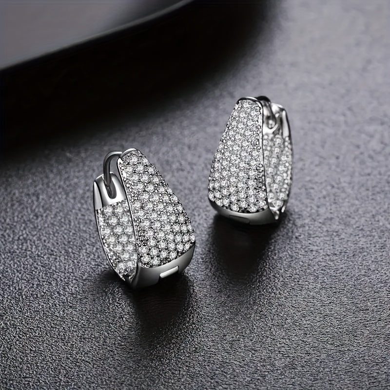 Stylish and versatile earrings adorned with sparkling zirconia, ideal for giving as a gift to friends or loved ones during the holiday season.