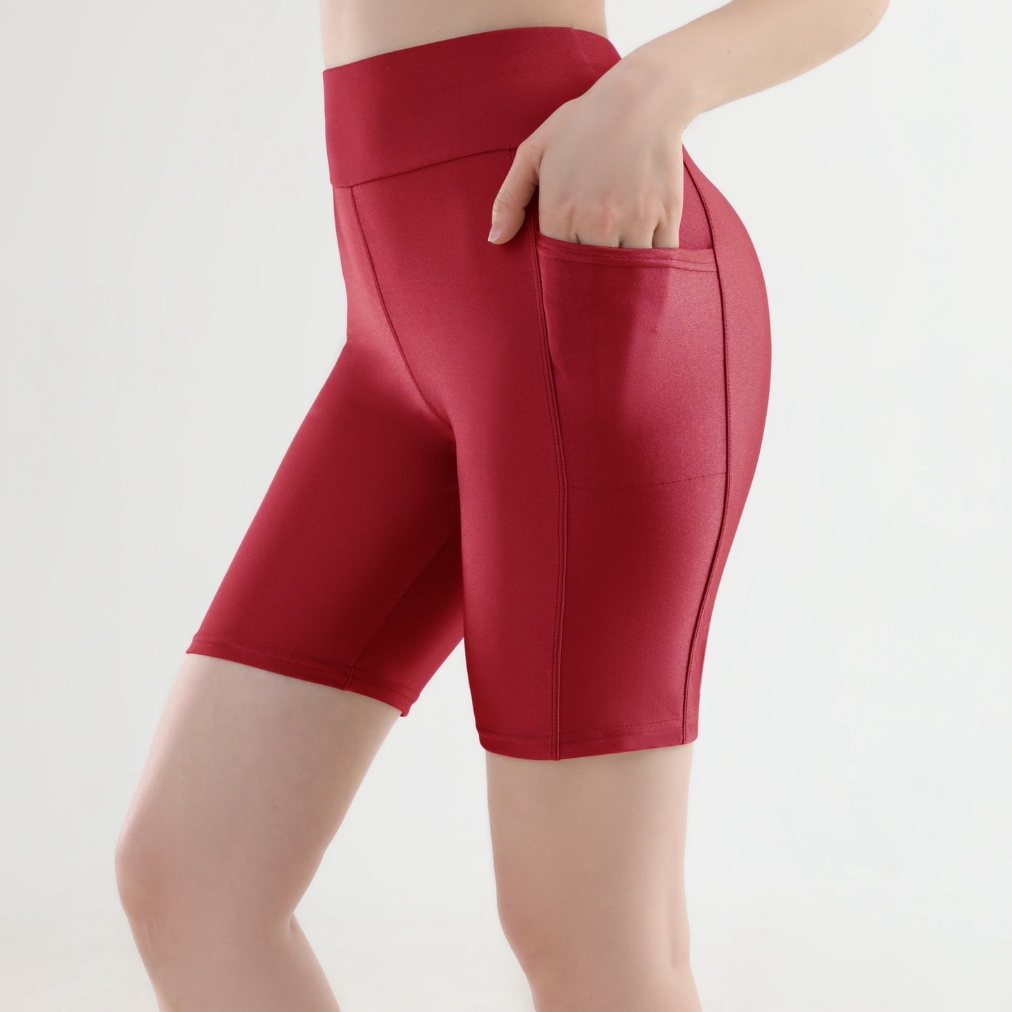 Sporty high-waist cropped leggings with side pockets, perfect for running.