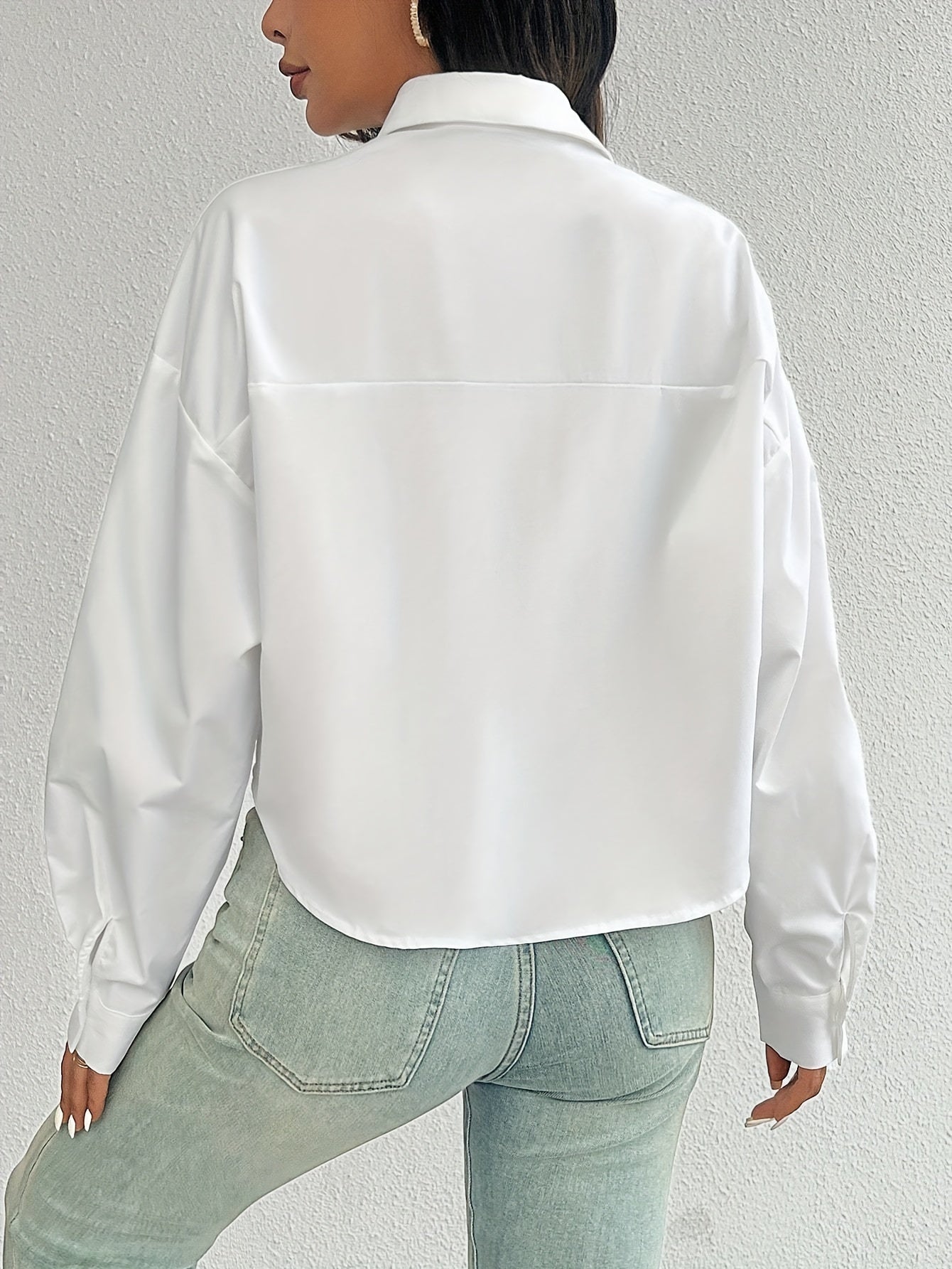 Stylish white casual shirt for women, drop shoulder, long sleeve, short style with pocket, button-up, made of 100% polyester, machine washable, ideal for casual wear.