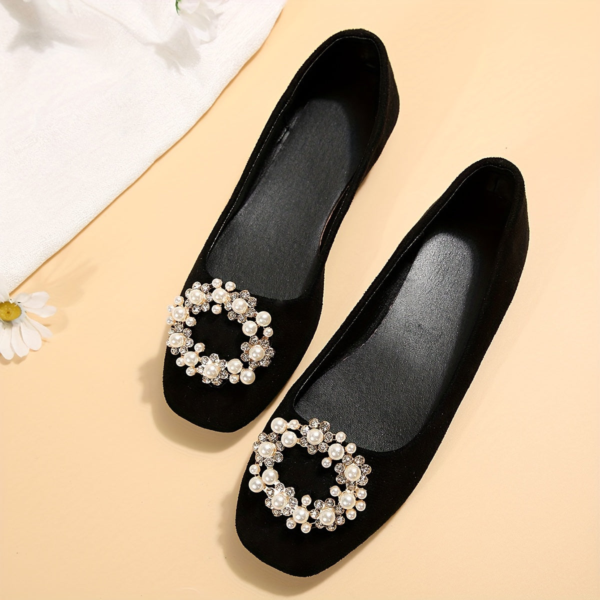 Women's black flat shoes with embellishments and comfortable fabric upper. Suitable for casual or formal occasions. Versatile and durable rubber sole.