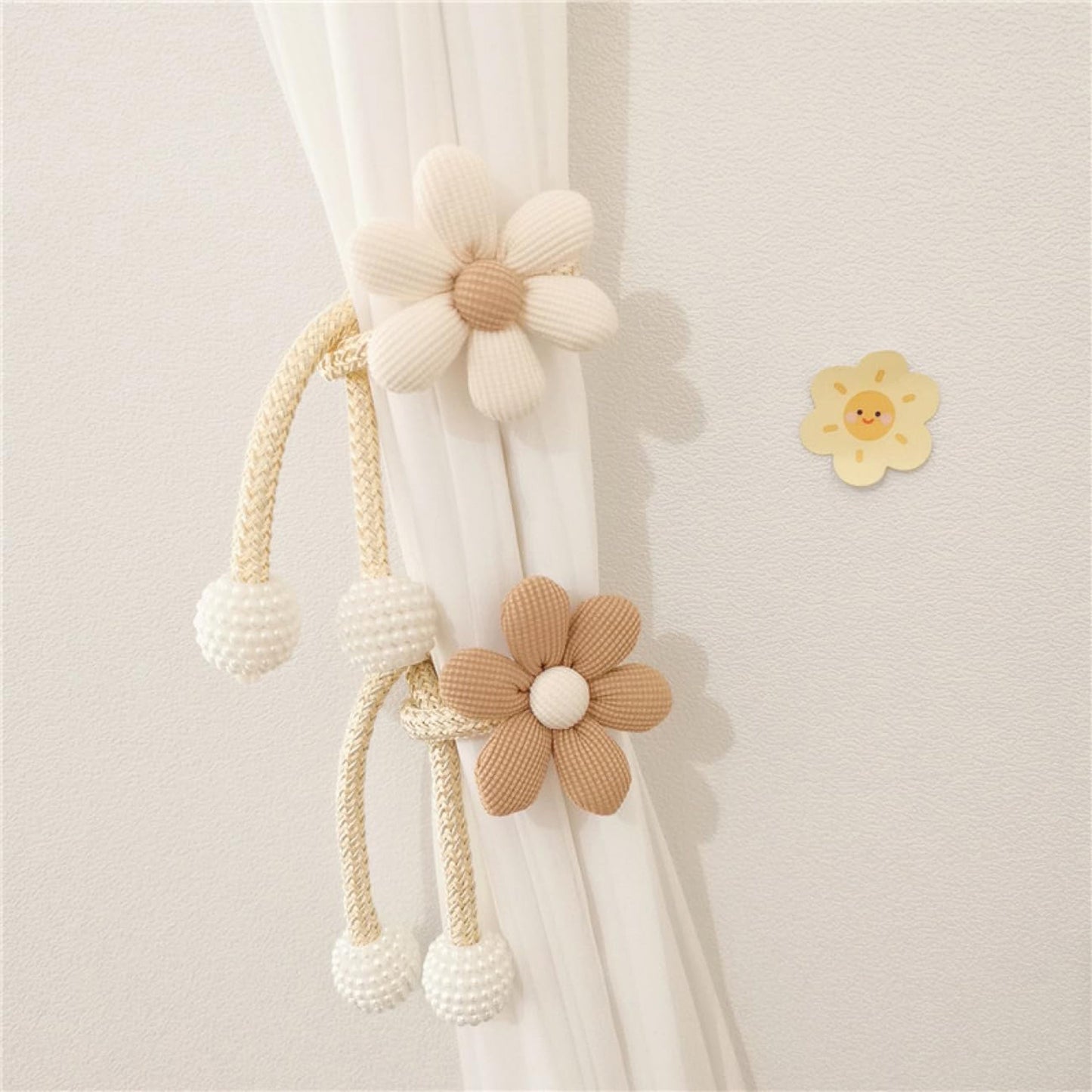 Elegant set of two curtain tiebacks featuring charming cartoon flowers and white faux pearl accents. No drilling required, making them ideal for bedrooms, living rooms, and children's rooms.