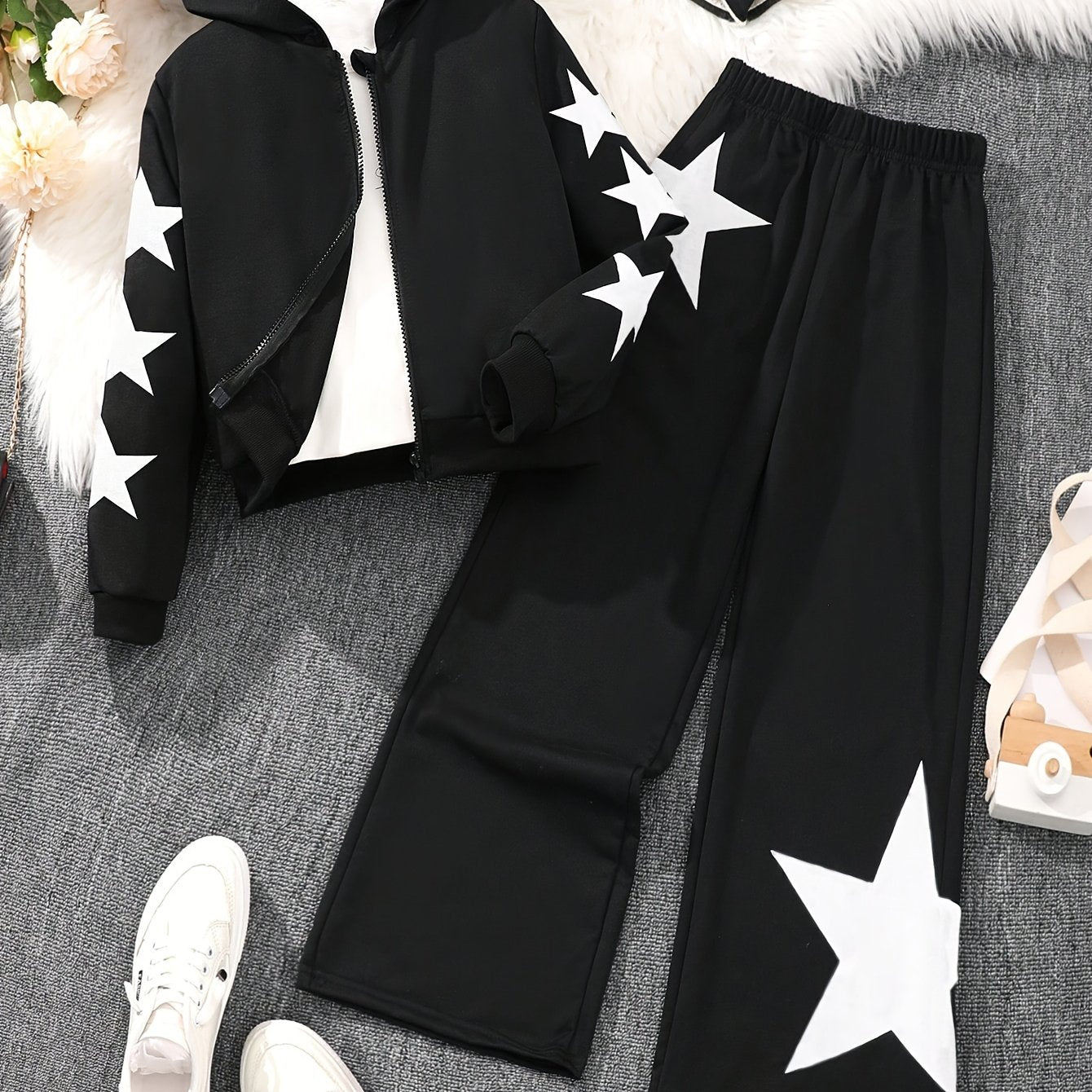 Polyester zip-up hoodie and pants set for girls with star pattern. Machine washable for easy care. Ideal for casual fall/winter outfits and outdoor activities.