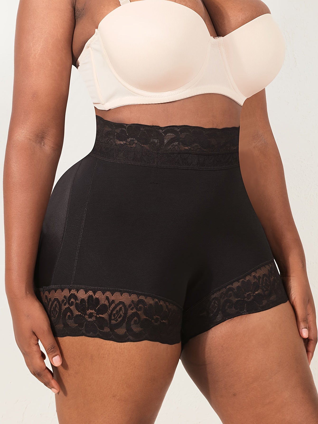 High waist shapewear shorts for plus-size women with lace trim, providing tummy control, butt lifting, and a comfortable fit.