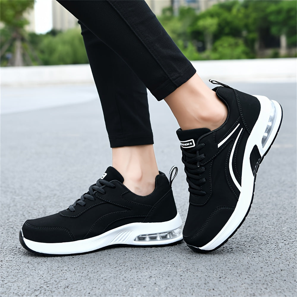 Women's casual sneakers made from black synthetic leather, featuring a lightweight design, air cushion support, lace-up style suitable for work, travel, or sports. Stylish and breathable