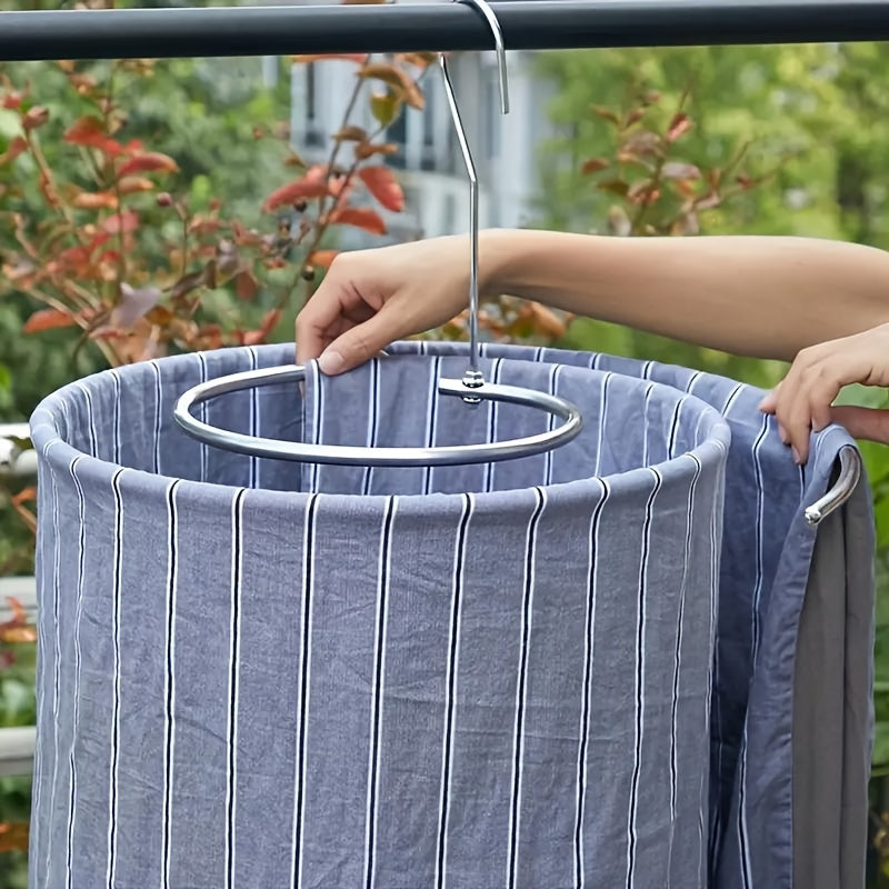 A versatile stainless steel spiral clothes hanger designed for drying quilts and bed sheets, featuring a rotating multi-functional rack complete with hooks for laundry poles.