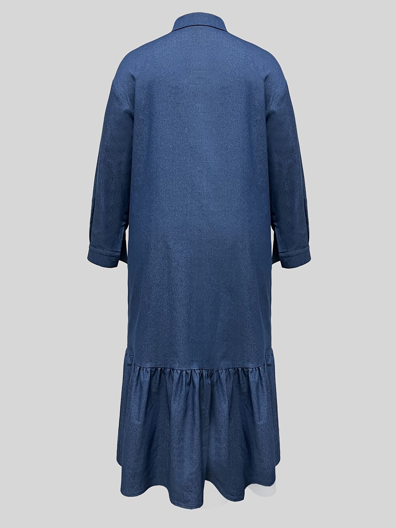 Maxi denim dress in washed blue for plus-size women, with ruffled hem and button-up long sleeves.