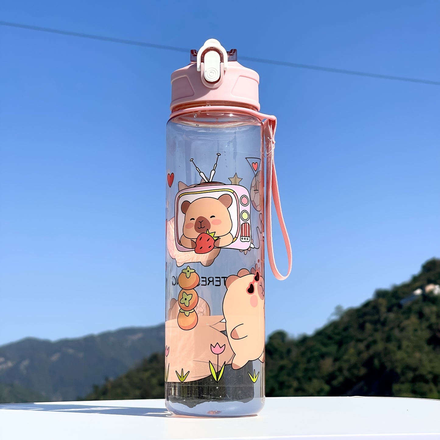 Adorable large sports water bottle with whimsical designs. Durable and portable, perfect for outdoor activities.