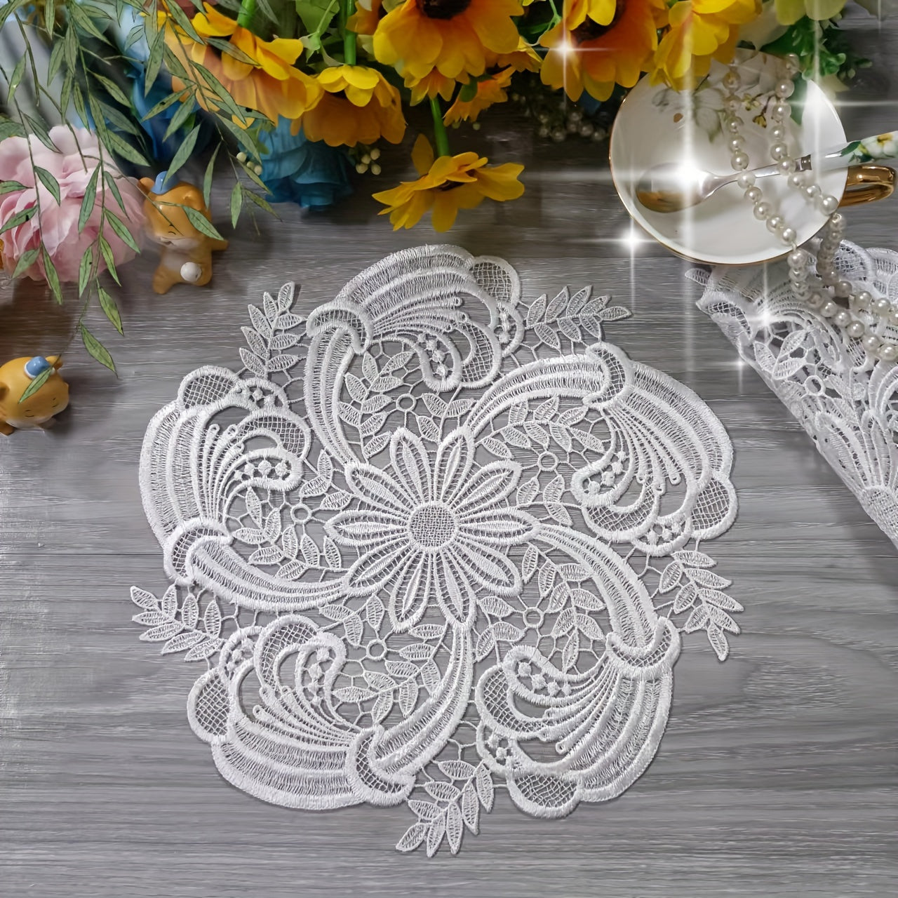 White velvet lace oval table runner with floral pattern, perfect for holiday table setting. Butterfly motif on decorative fabric for dining and home decor.