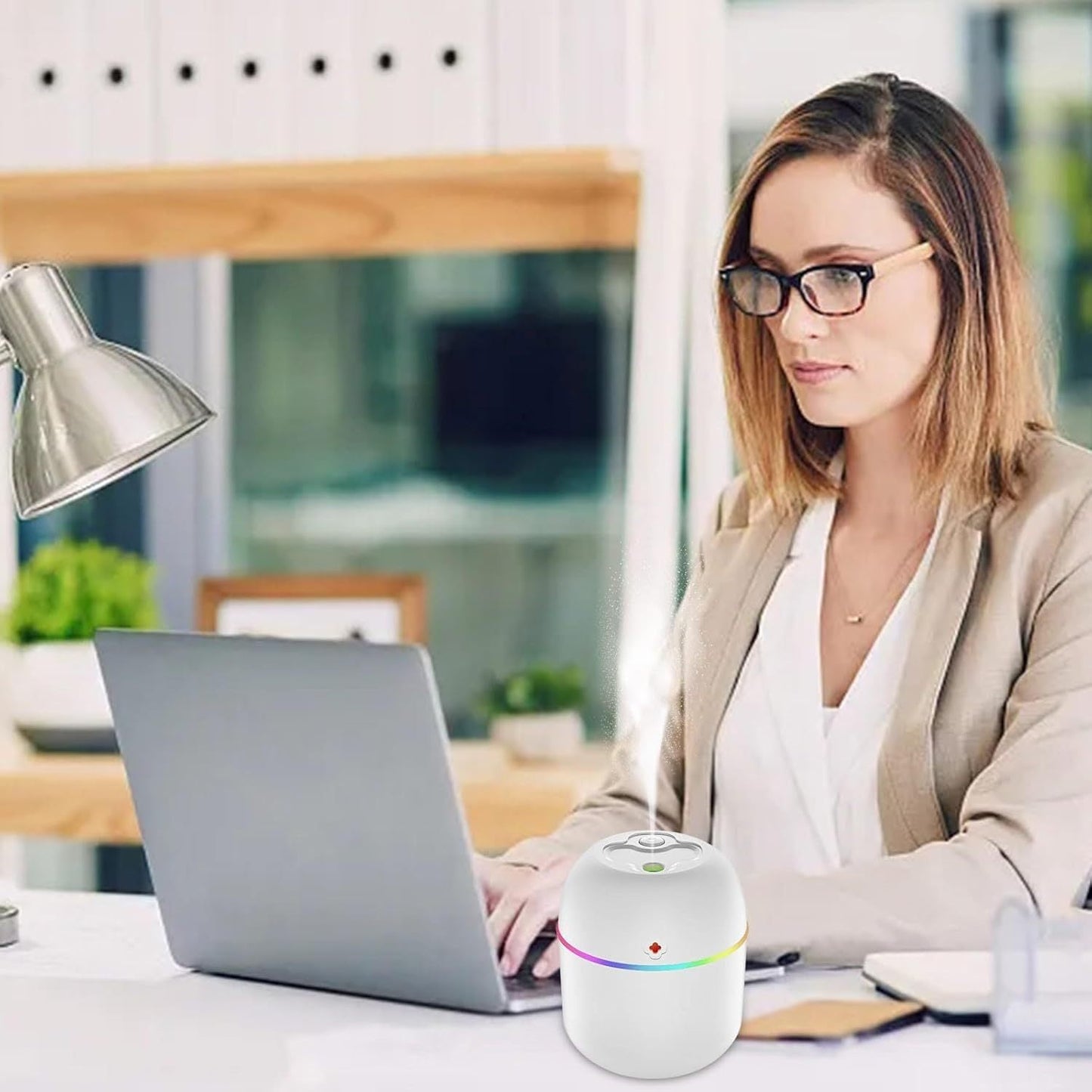 Small humidifier and aromatherapy diffuser that runs on USB power, featuring ambient light - Great for use at home, in the office, or in the car. Makes a perfect gift for Christmas, New Year, Valentine's Day, and weddings.