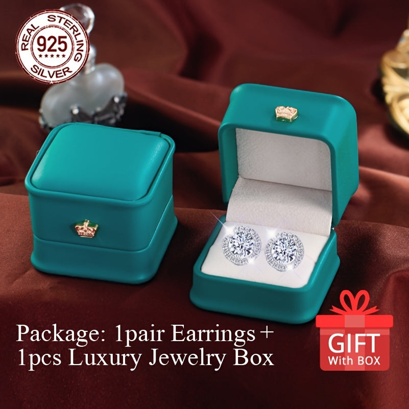 Get a pair of timeless heart-shaped synthetic zirconia stud earrings, perfect for any occasion. Made of 925 sterling silver plated material, these earrings are hypoallergenic and feature a simple round design. They come in a beautiful gift box, making