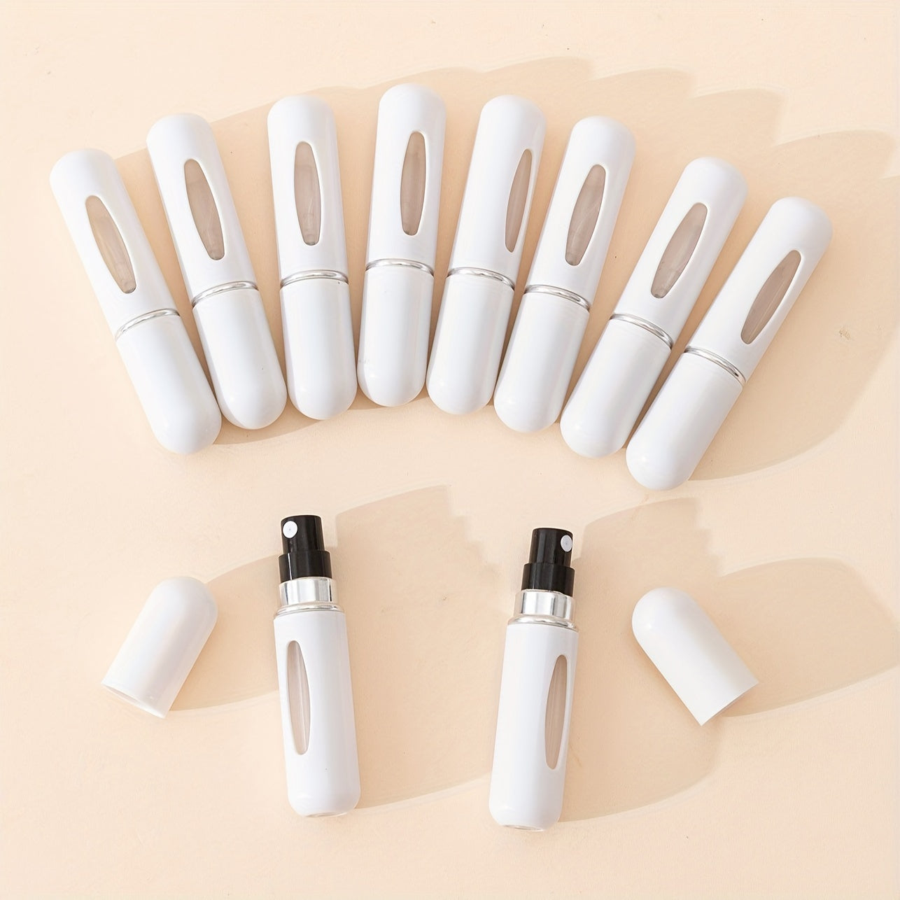 10 count of 5ml portable fine mist spray bottles for perfume, oil, cologne, and liquid. Easy-pump design for convenient travel refill.