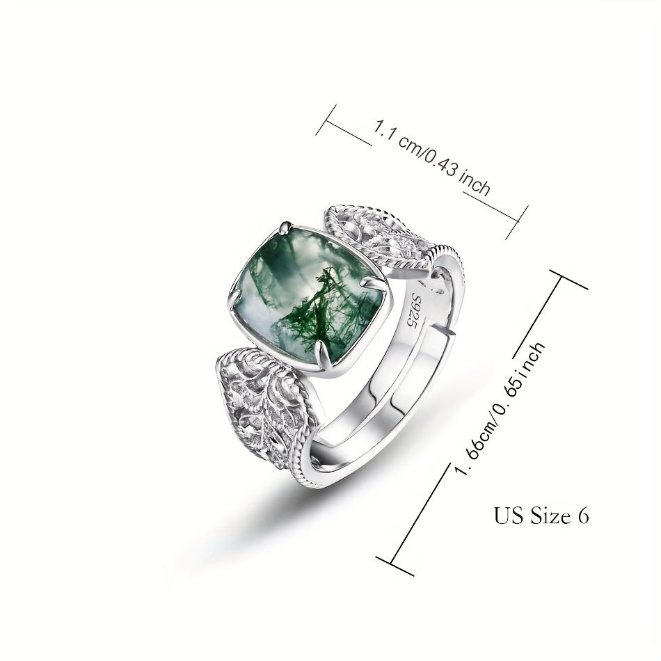 The Vintage-Inspired Green Moss Agate Open Ring is a timeless piece made with 2.4CT of stunning green moss agate set in S925 sterling silver. This elegant ring is perfect for both daily wear and gifting. Featuring a unique water grass design, the stone