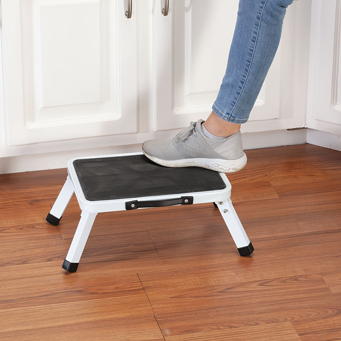 Black 1pc Foldable Step Stool featuring a portable handle for use in offices, kitchens, and homes. Can also be utilized as a lightweight folding footstool, a small home stool, an RV stool, and a four-legged ladder stool.