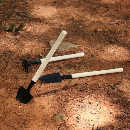 Three-piece set of mini gardening tools: multi-function shovel, harrow shovel, and household plant pine soil shovel.