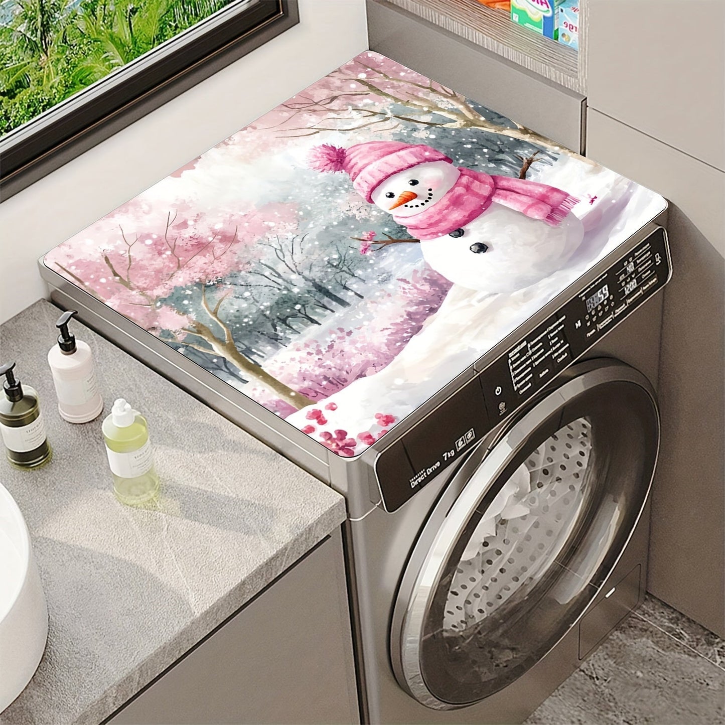 Keep your washing machine clean and festive with this 1-piece dust cover featuring a pink snowman and cherry blossom winter scene. This cover is quick-drying, absorbent, and non-slip, providing protection for your appliance and adding a decorative touch