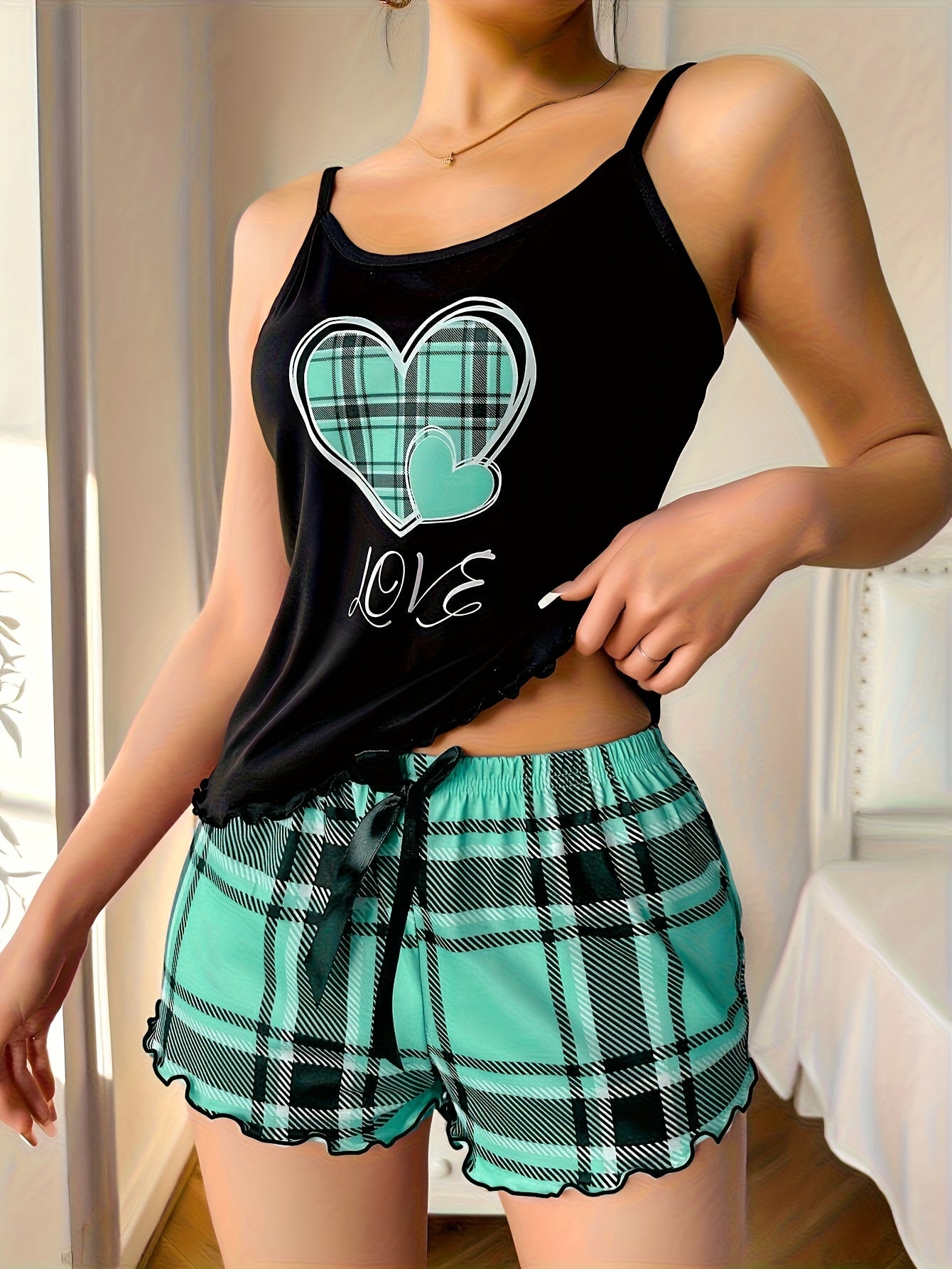 Women's cozy plaid heart pajama set with frill trim, cami top, and shorts for a relaxed summer nightwear look