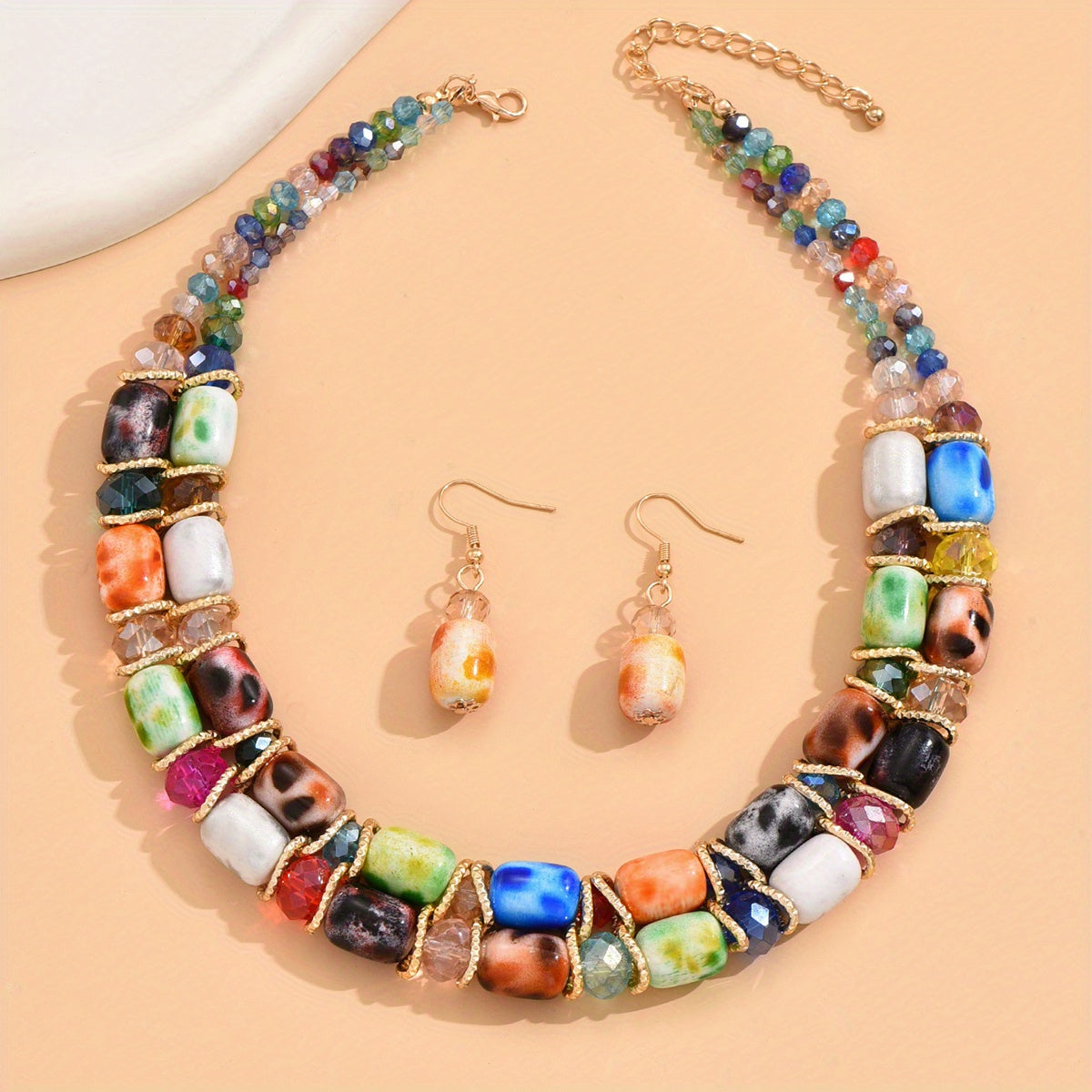 Complete your look with this Bohemian-style women's jewelry set featuring a 2-strand beaded necklace and earrings, suitable for everyday wear or special events.