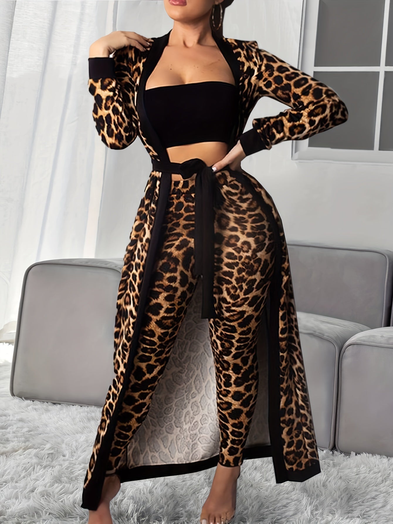 Women's loungewear set includes leopard print robe with belt, strapless crop top, and pants.