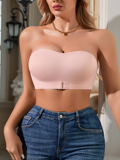 Smooth light pink bralette with elegant front closure, non-slip grip, wireless and padded, made from breathable nylon/elastane blend, machine washable.