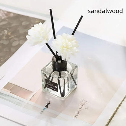 Elegant white floral diffuser with black sticks, versatile air freshener for bathroom, bedroom, car, and outdoor use. 1L capacity, glass container, indoor aesthetic.