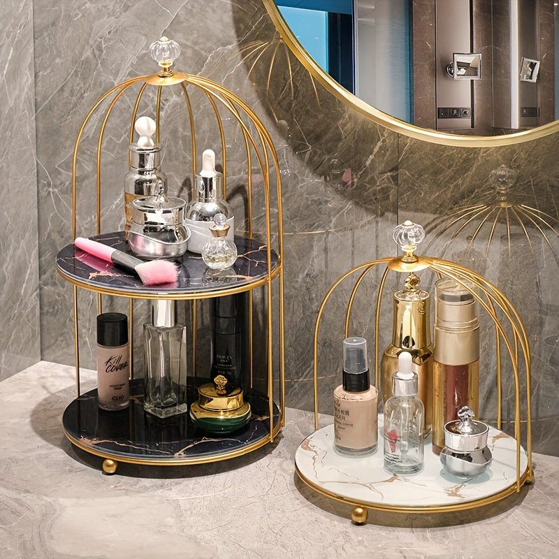 Elegant golden and white marble birdcage-inspired 2-tier makeup organizer with stainless steel rack and electrostatic spray finish. Portable and freestanding for bathroom and bedroom decor.