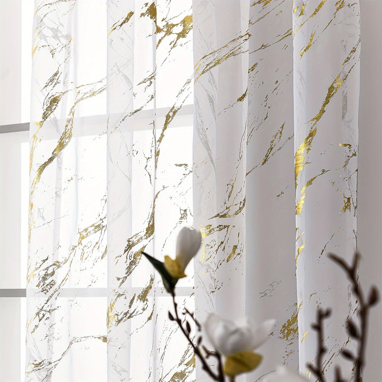 Elegant sheer curtains featuring a marble pattern print, perfect for enhancing the decor of living rooms, bedrooms, and office windows.