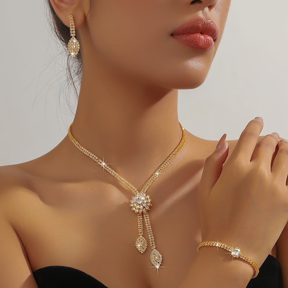 Trendy Imitation Zirconia Flower Jewelry Set, including Necklace and Earrings or Necklace, Earrings, and Bracelet. Perfect for a glamorous bride or special occasion. Accessorize with luxury at weddings or banquets.