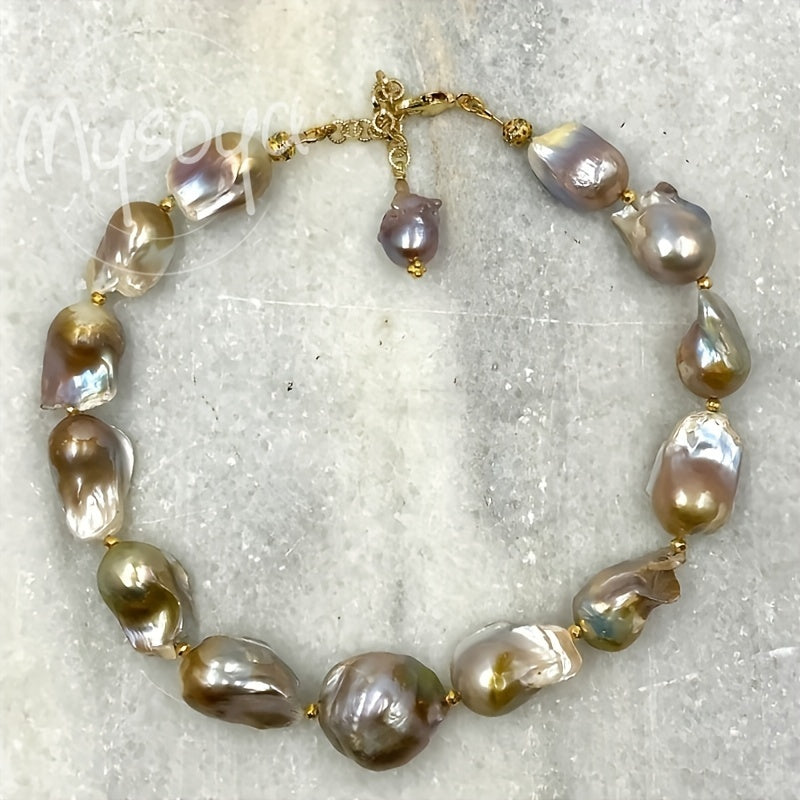 Handcrafted MYSOYA Baroque Pearl Necklace featuring 100% natural freshwater pearls ranging from 21-28mm. This elegant and luxurious jewelry piece is perfect for everyday wear, weddings, and special occasions. Makes a stunning Valentine's Day gift or June