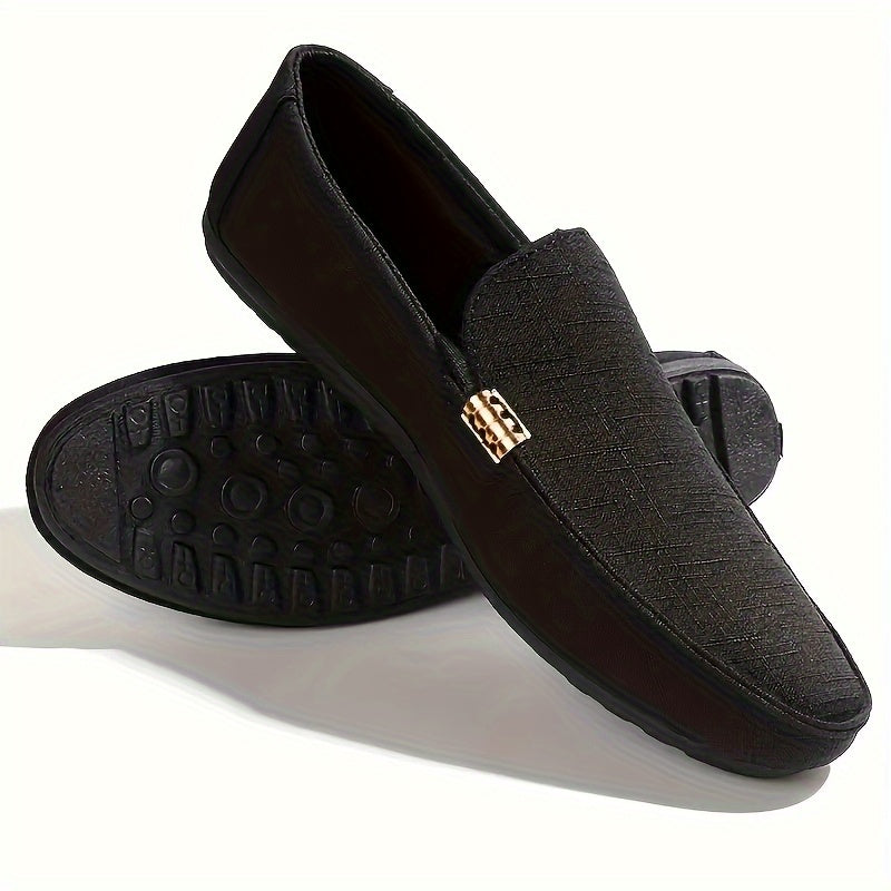 Men's black canvas loafers with metal decor, round toe, comfortable insole, suitable for casual and outdoor wear.