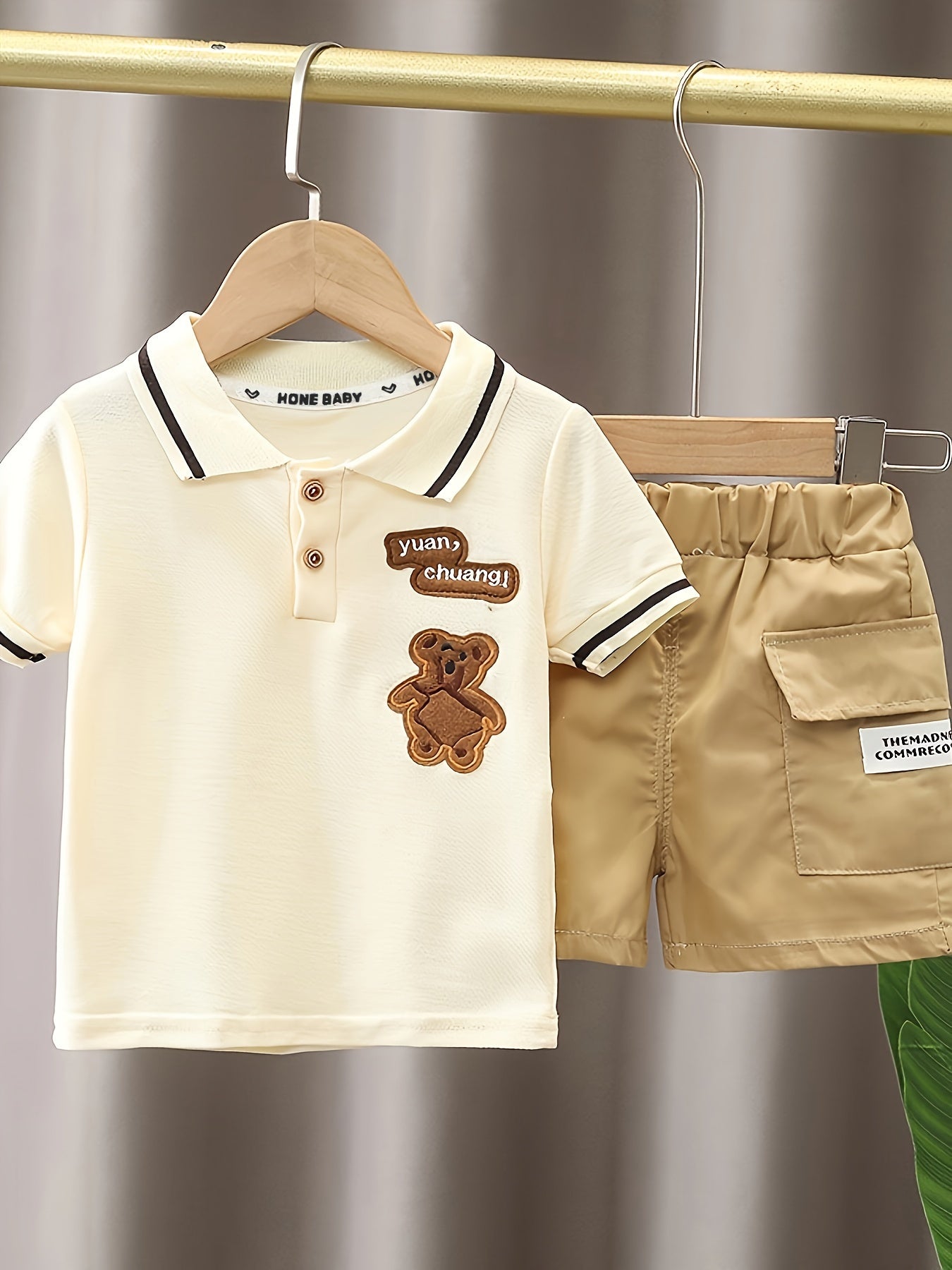 Infant boys' adorable bear embroidered summer outfit with short-sleeve golf shirt and pocketed shorts, perfect for outdoor activities.