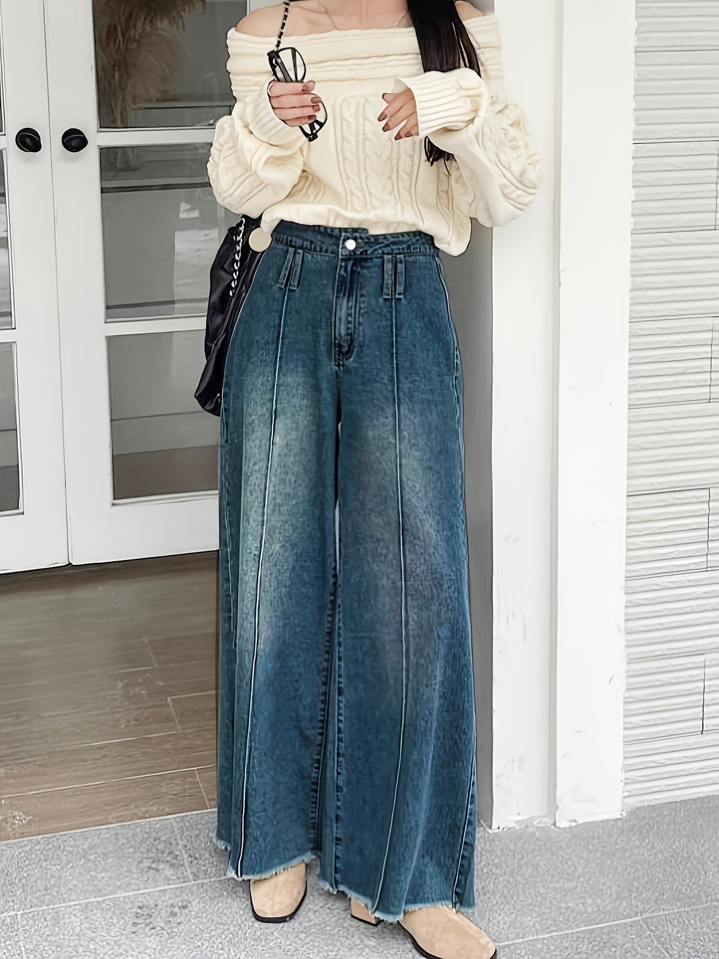 Women's wide-leg denim jeans with elastic waistband, loose fit, mid-rise, and slash pockets in light to dark blue gradient.