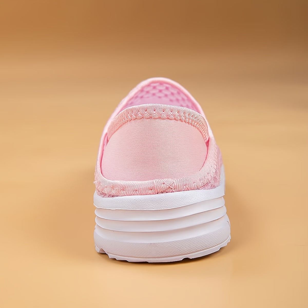 Mesh slip-on walking shoes with stability support, lightweight white summer footwear.