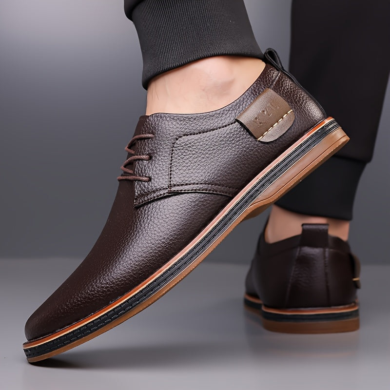 One pair of men's business casual shoes with hand stitched low top lace-up design, flat rubber sole, faux leather upper, inner lining and insole.