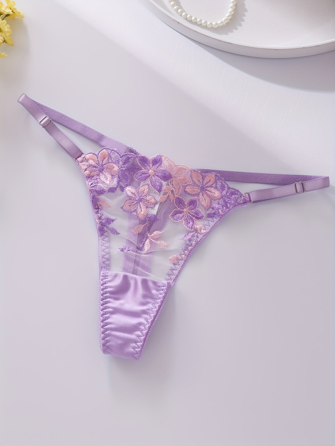 Floral embroidered lingerie set for women, featuring a sexy floral pattern, made from a blend of polyester and elastane. The set includes a medium support bra with underwire and no padding