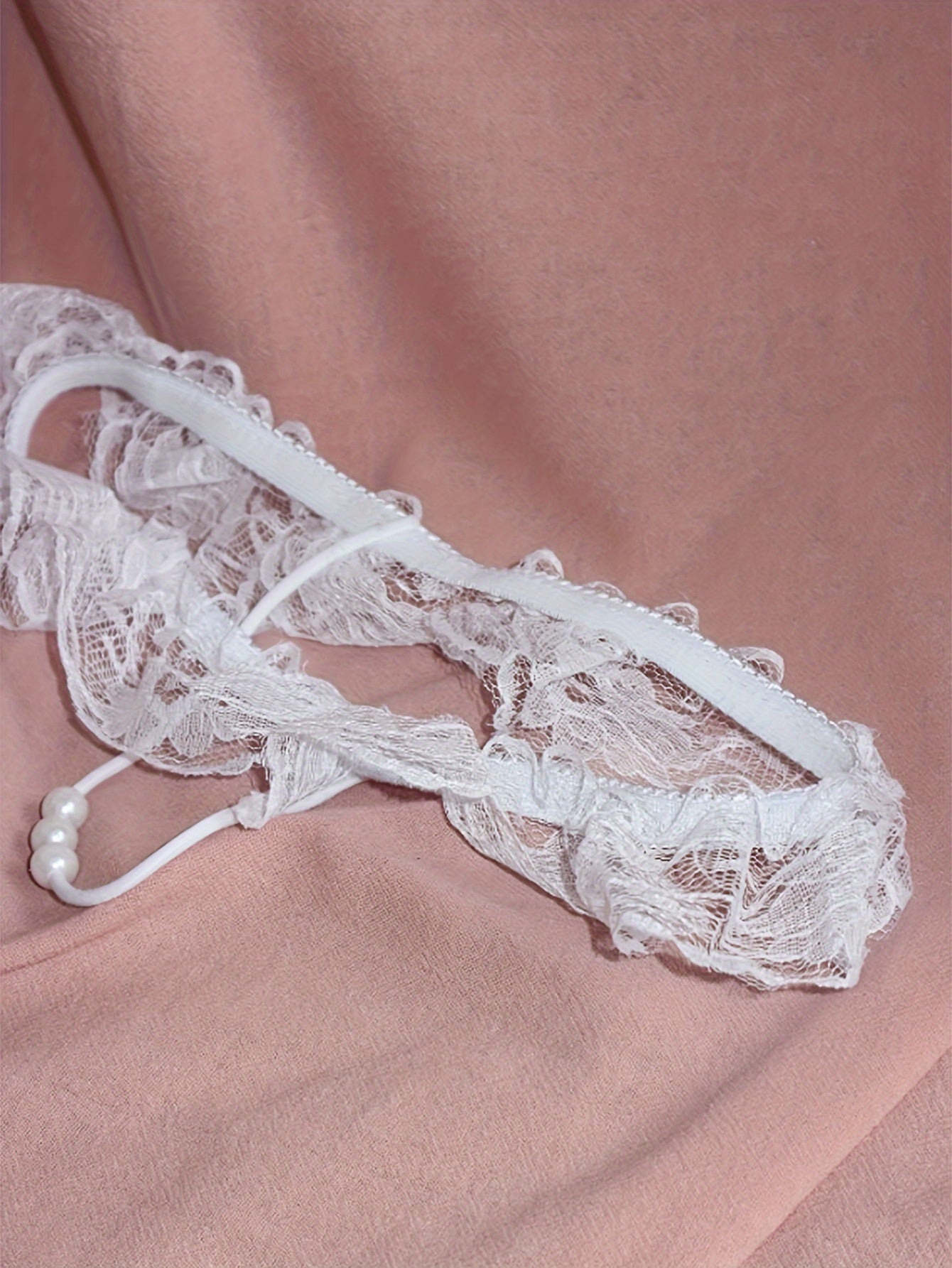 Sexy lingerie for women featuring lace faux pearl bead decoration T-string thongs.