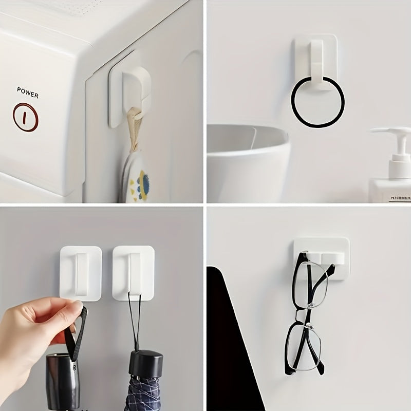 Wall-mounted comb holder for bathroom storage, featuring a punch-free design and multifunctional storage hook.