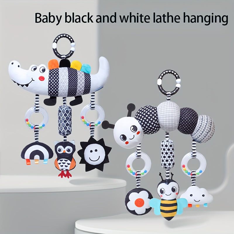 Soft and cuddly black and white animal wind chime plush toys, perfect for baby car seats and strollers. These hanging rattle toys are made of soft cloth and come from the Chinese Mainland. An ideal Christmas gift for infants aged 0-3 years old.