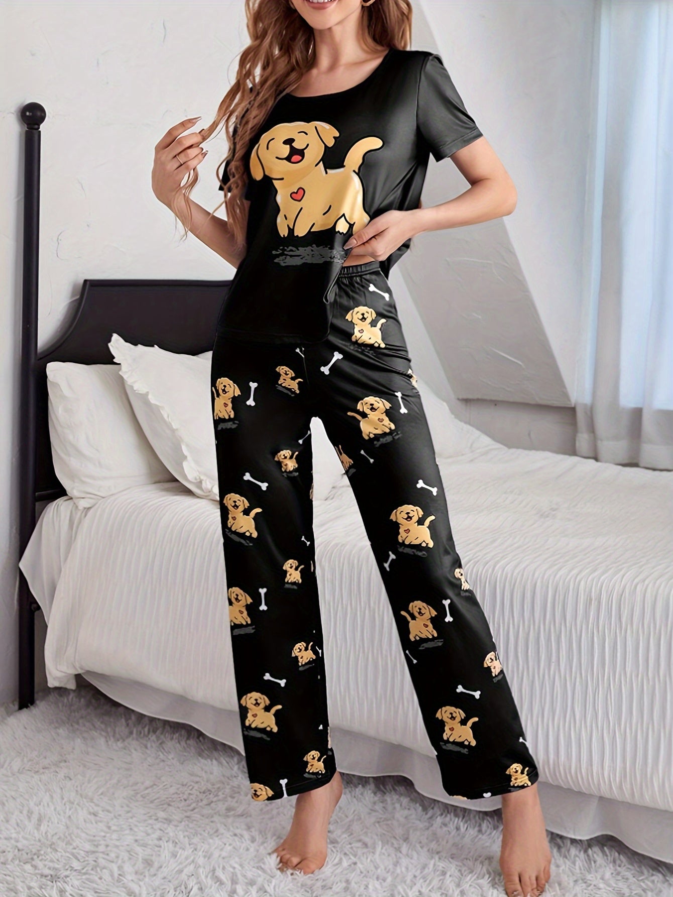 Women's sleepwear set with cute puppy print, short sleeve top, and elastic pants.