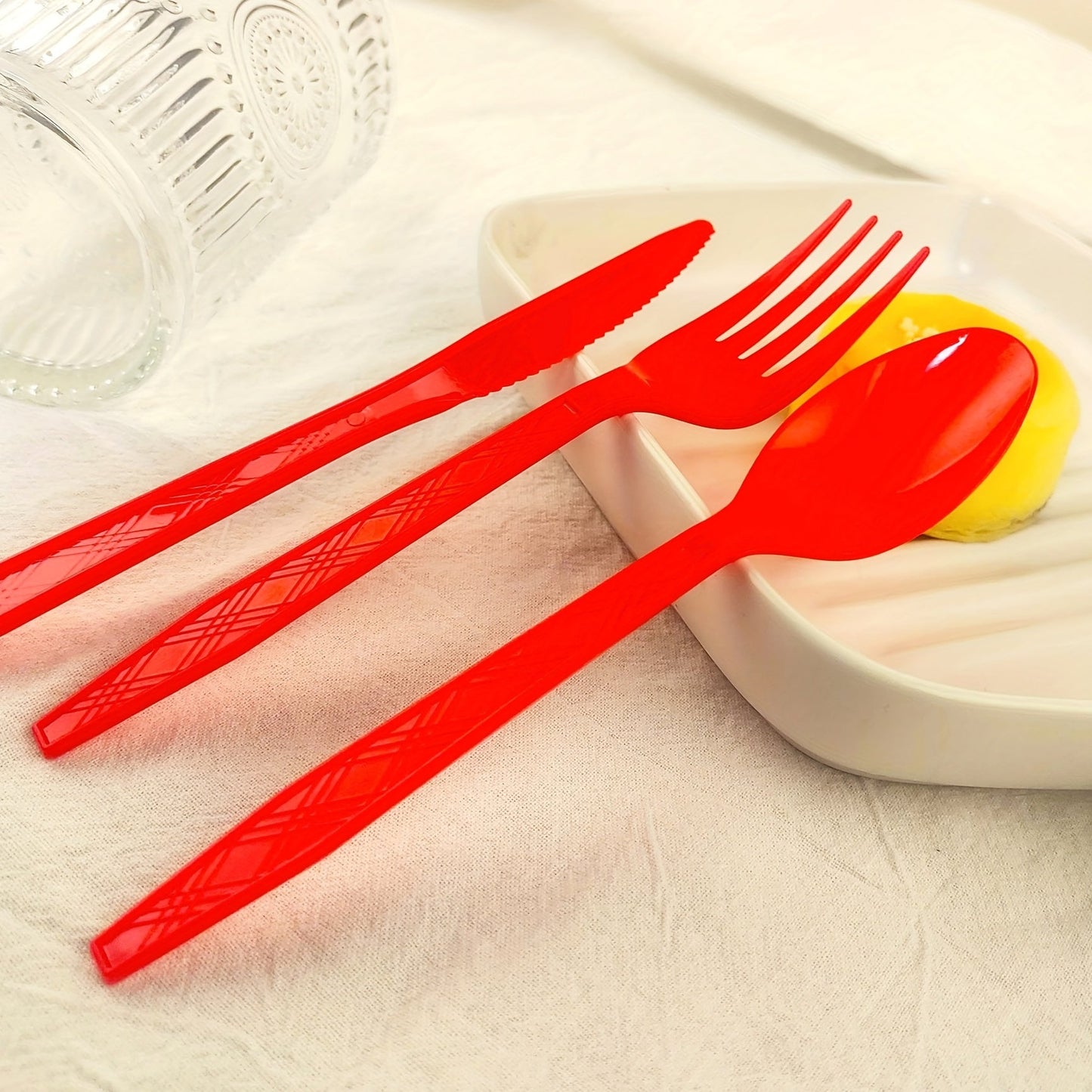 Set of 3 colored disposable plastic tableware pieces for weddings, birthday parties, and cake servings. Includes knives, forks, and spoons (30 pieces total).