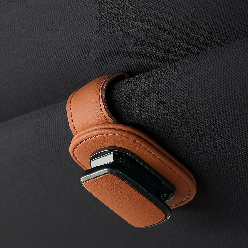 High-quality faux leather car sun visor clip with sturdy glasses holder, universal fit for dashboard and console storage.