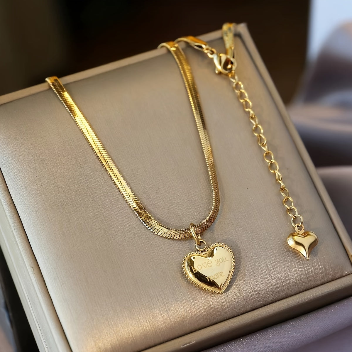 Stylish Heart Pendant Snake Chain Necklace for Women, featuring 18K Gold Plating and sleek 316 Stainless Steel. Perfect for everyday wear or as a thoughtful gift. This necklace does not have any stone inlay.