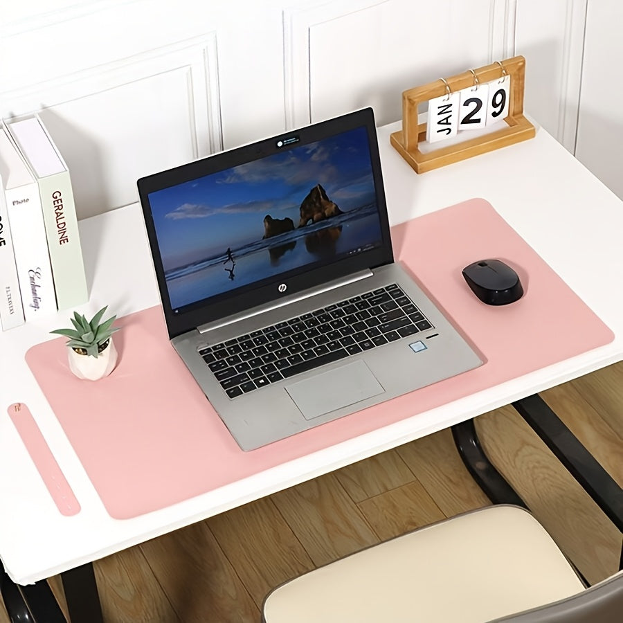 Waterproof faux leather desk pad with anti-slip surface for office and home use. Measures 59.99 x 32.99 cm. Rectangular mouse pad for workspace protection. Sleek and easy to clean design.